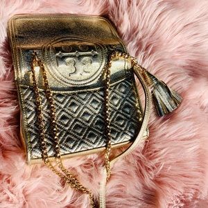 Gold Tory Burch crossbody bag with chains